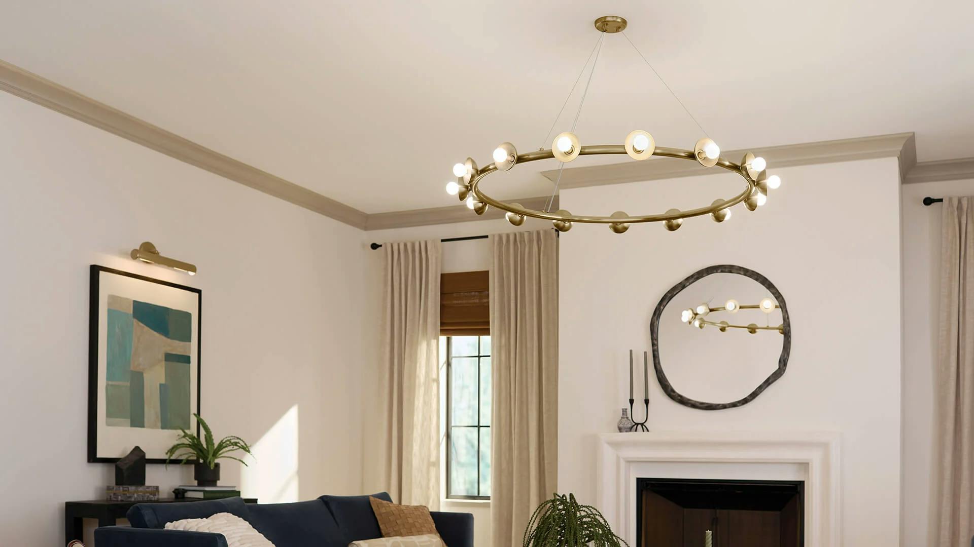 Living room during the day featuring a champagne bronze finish palta chandelier.
