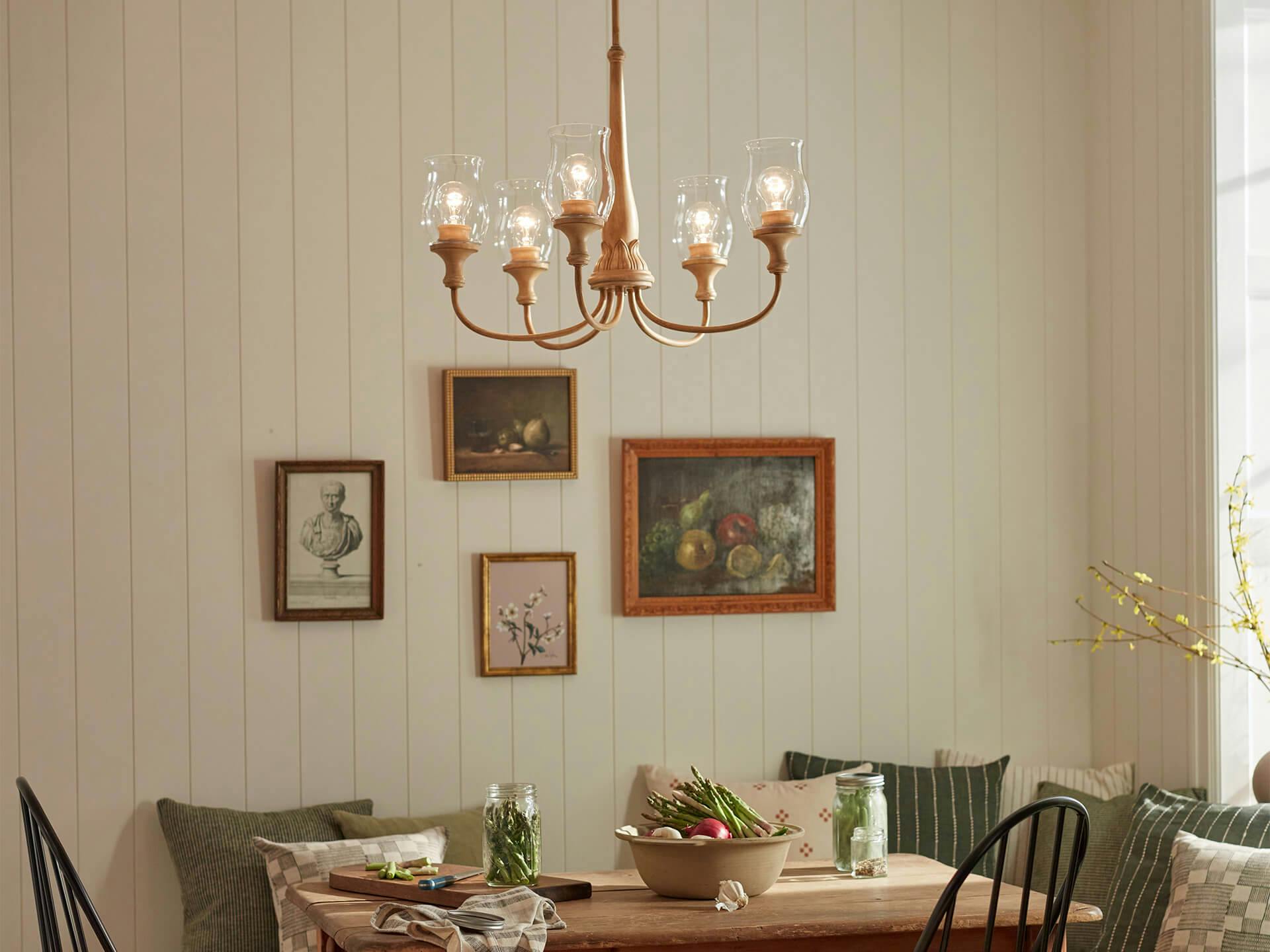 6 light Melis chandelier above a dinning room table in the day turned on