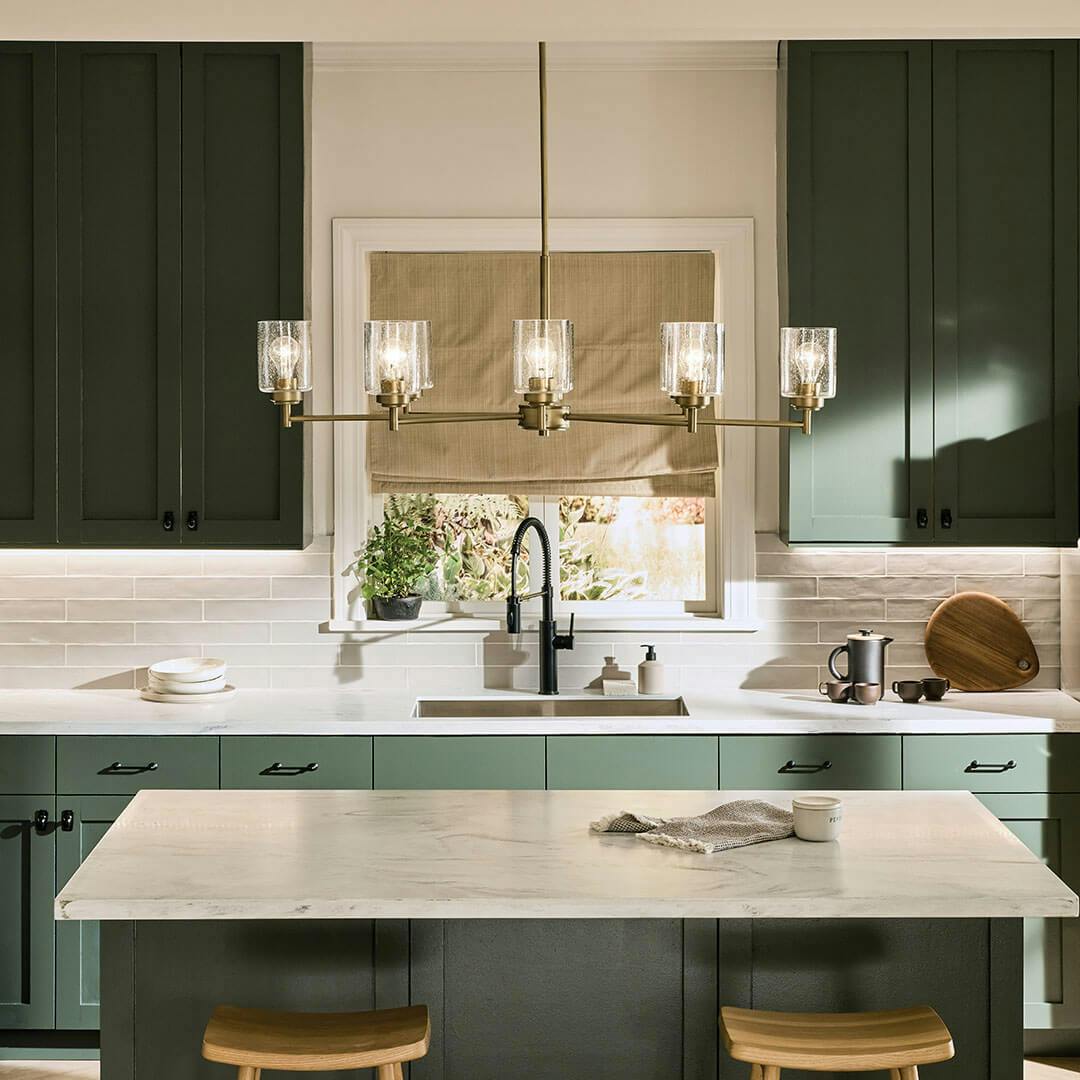 Kitchen in day light with the Winslow 14.75" 8-Light Chandelier in Natural Brass