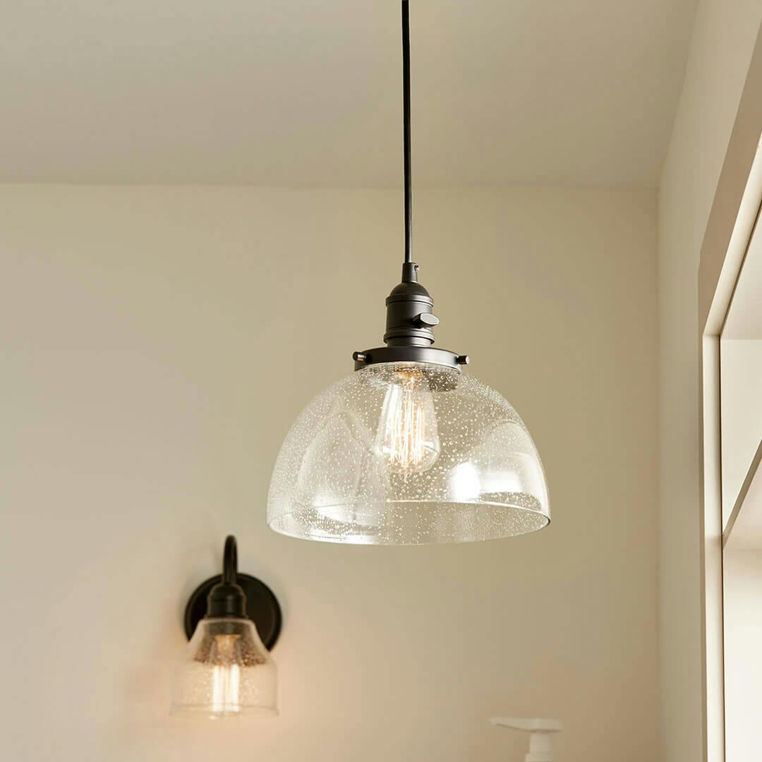 Laundry room in day light with the Avery 9.5 Inch 1 Light Goblet Mini Pendant with Clear Seeded Glass in Black