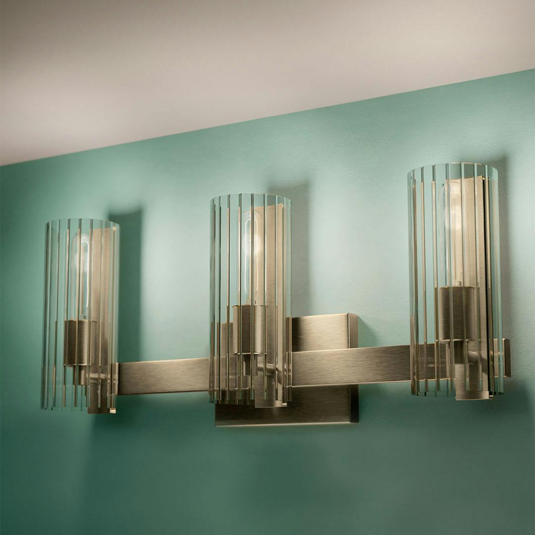 Day time bathroom with the Jemsa 22.75" 3 Light Vanity Light with Clear Fluted Glass in Champagne Bronze