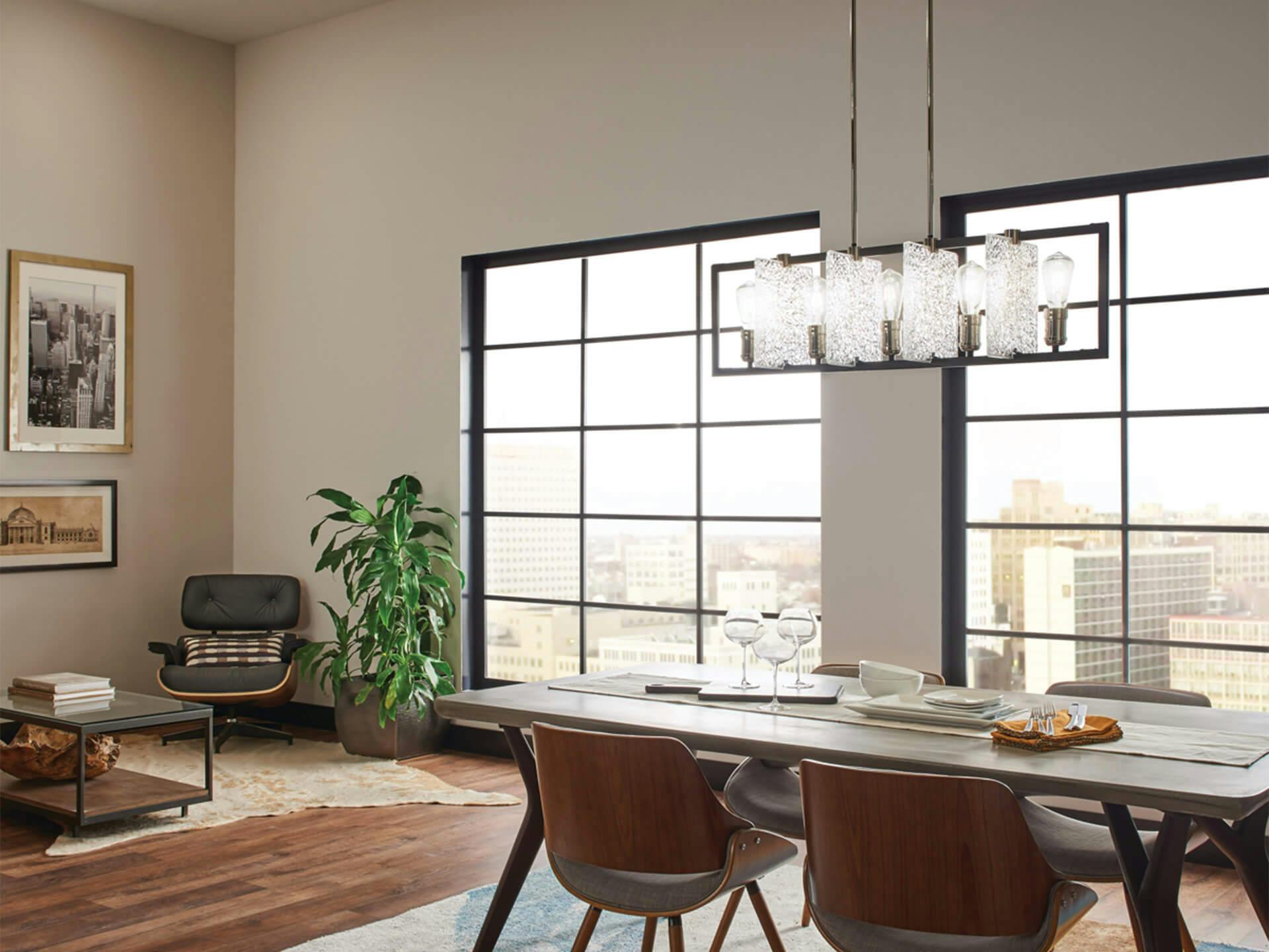 High rise mid-century modern dining room featuring Forge chandelier above a dining table