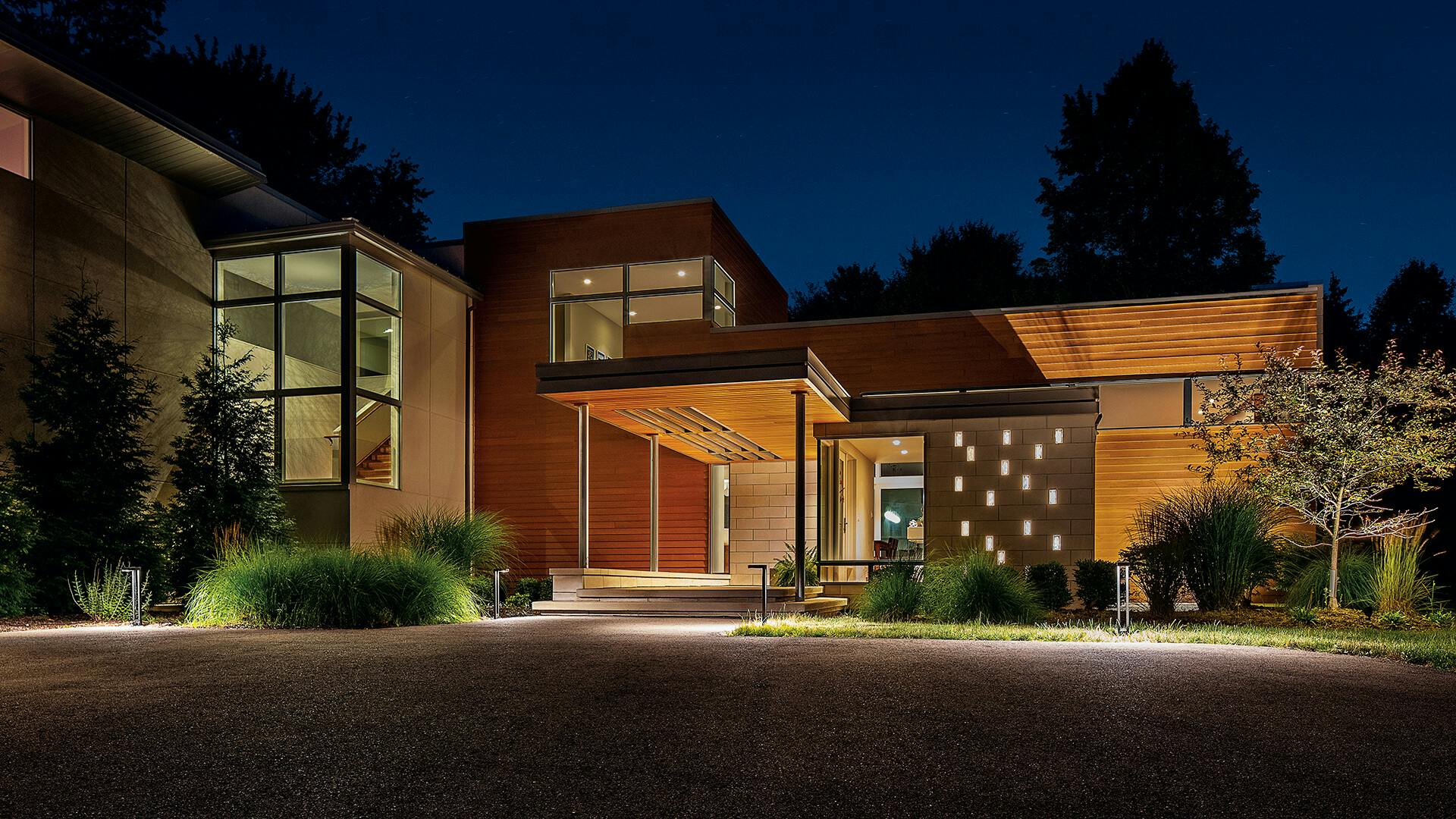 Contemporary residential home with variety of lighting outside and inside