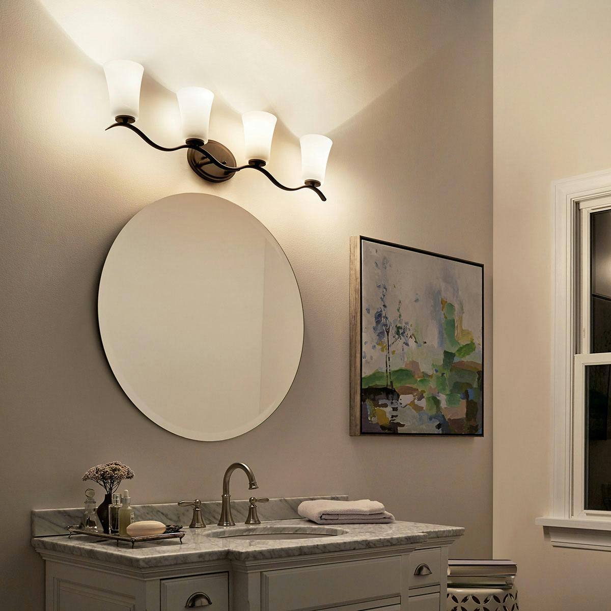 Night time Bathroom featuring Armida vanity light 45377OZ