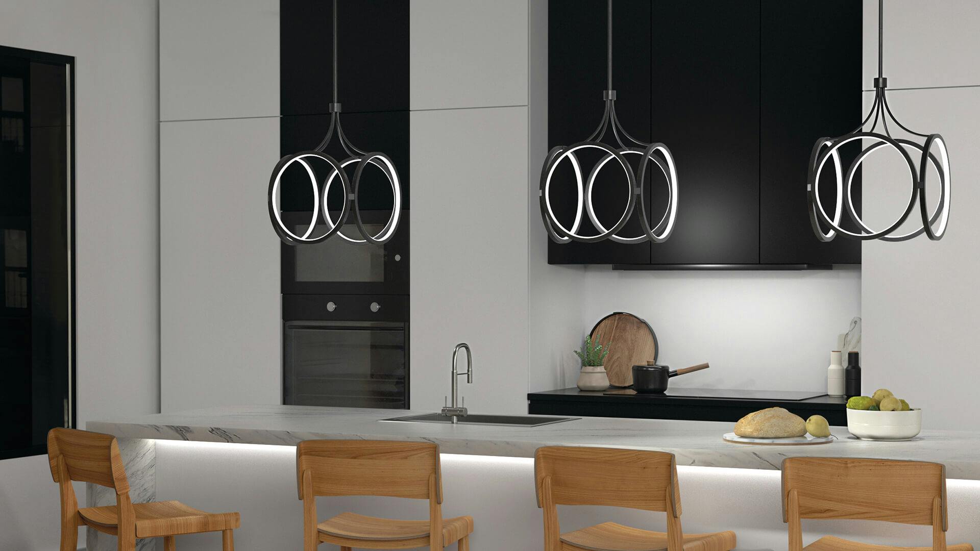 Kitchen at night with three Ciri pendants in black hanging above a long marble island