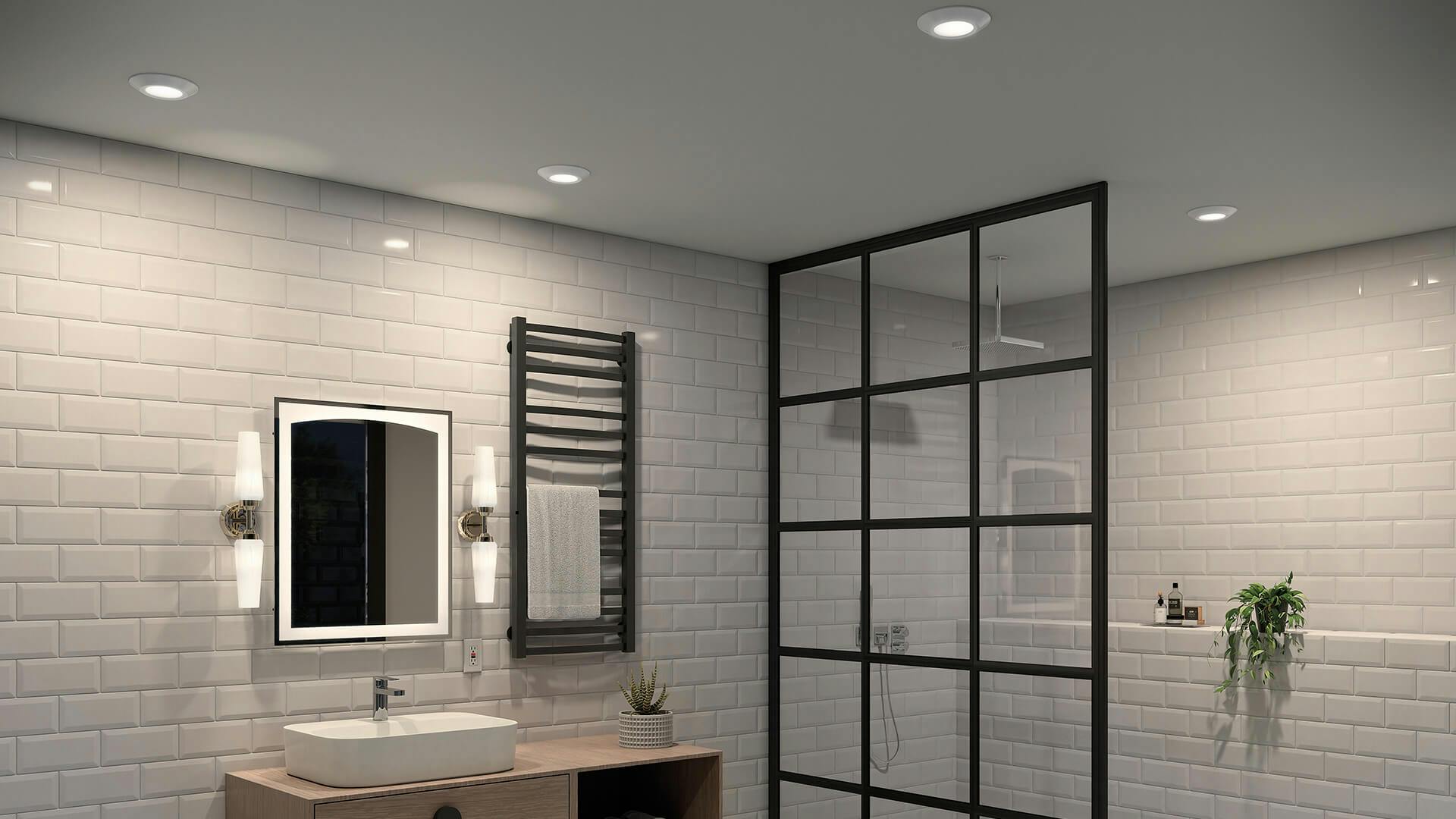 White bathroom with subway tile and floating vanity with Horizon III downlights on the ceiling