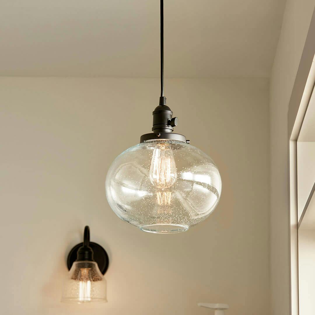 Laundry room in day light with the Avery 11.25 Inch 1 Light Mini Pendant with Clear Seeded Glass in Black