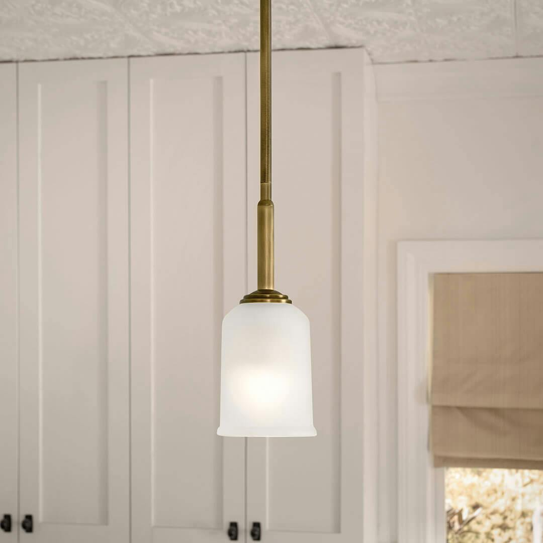 Kitchen in day light with the Shailene 11" 1-Light Mini Pendant in Natural Brass