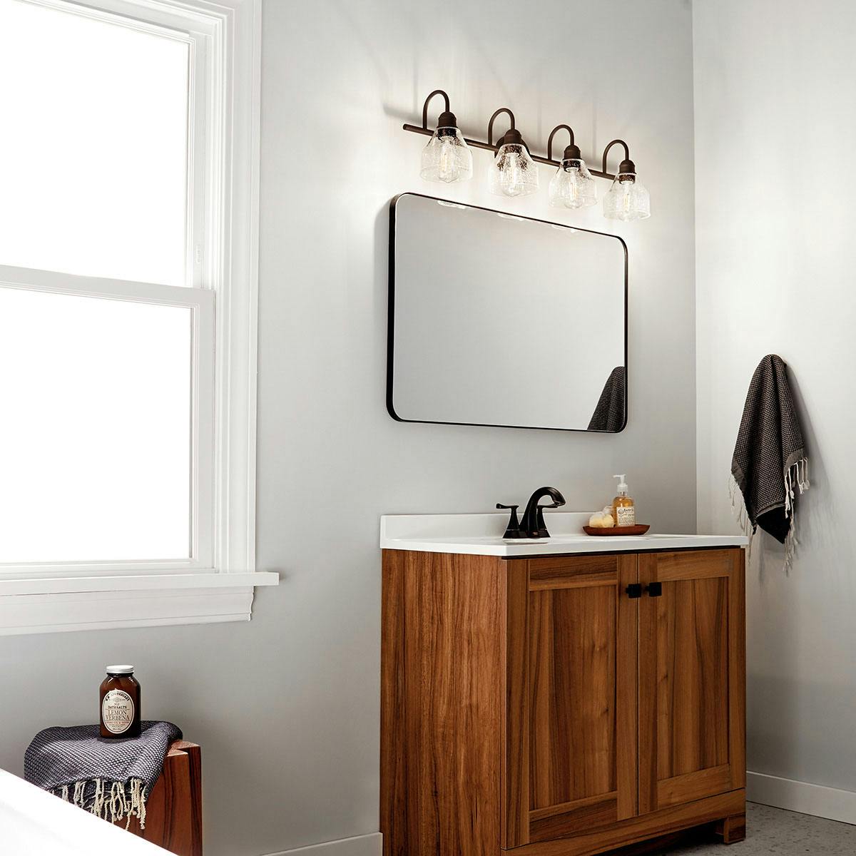 Day time Bathroom featuring Avery vanity light 45974OZ