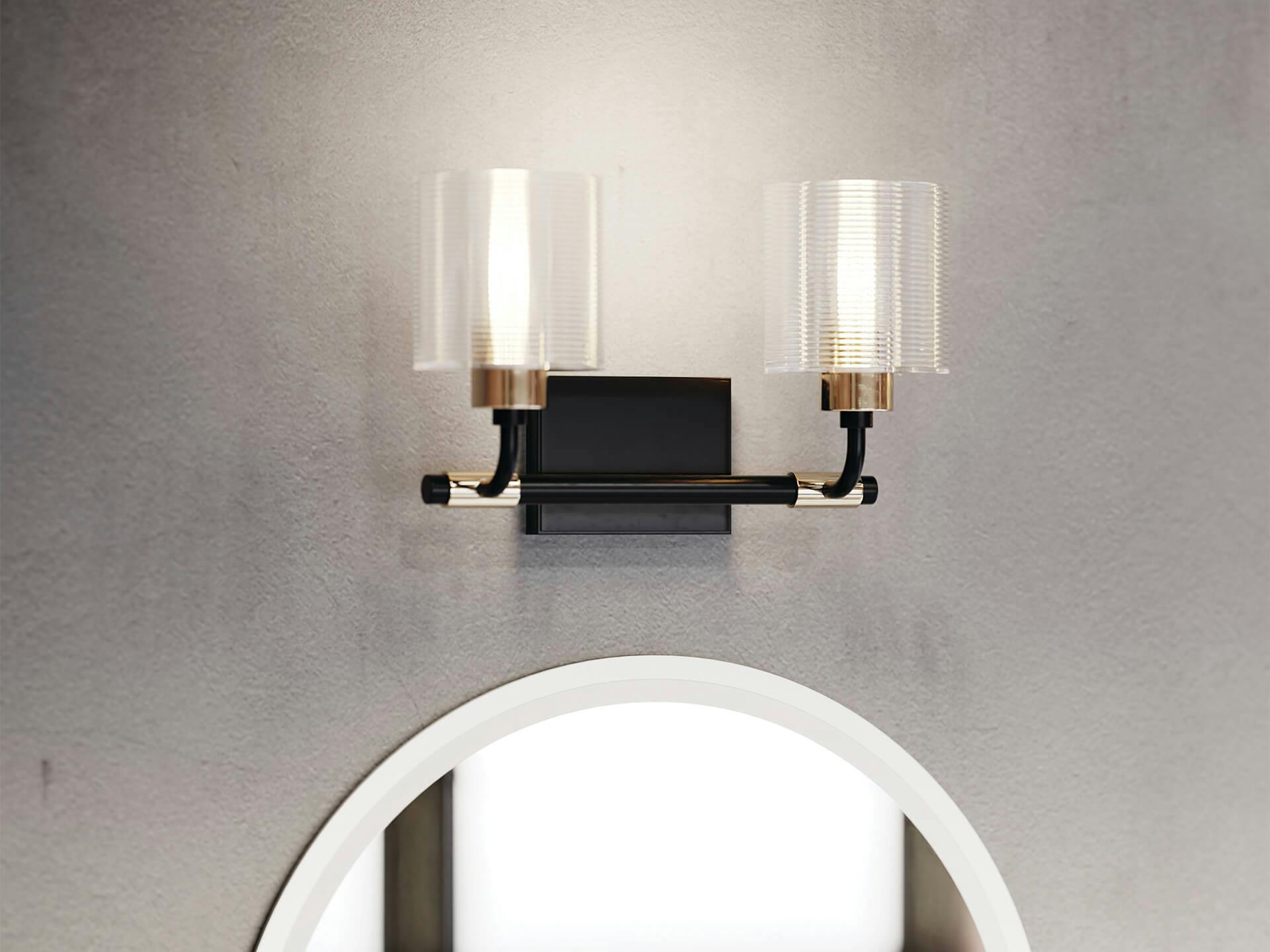 Detailed zoomed in photo of a Harvan Menillo vanity light above a mirror 
