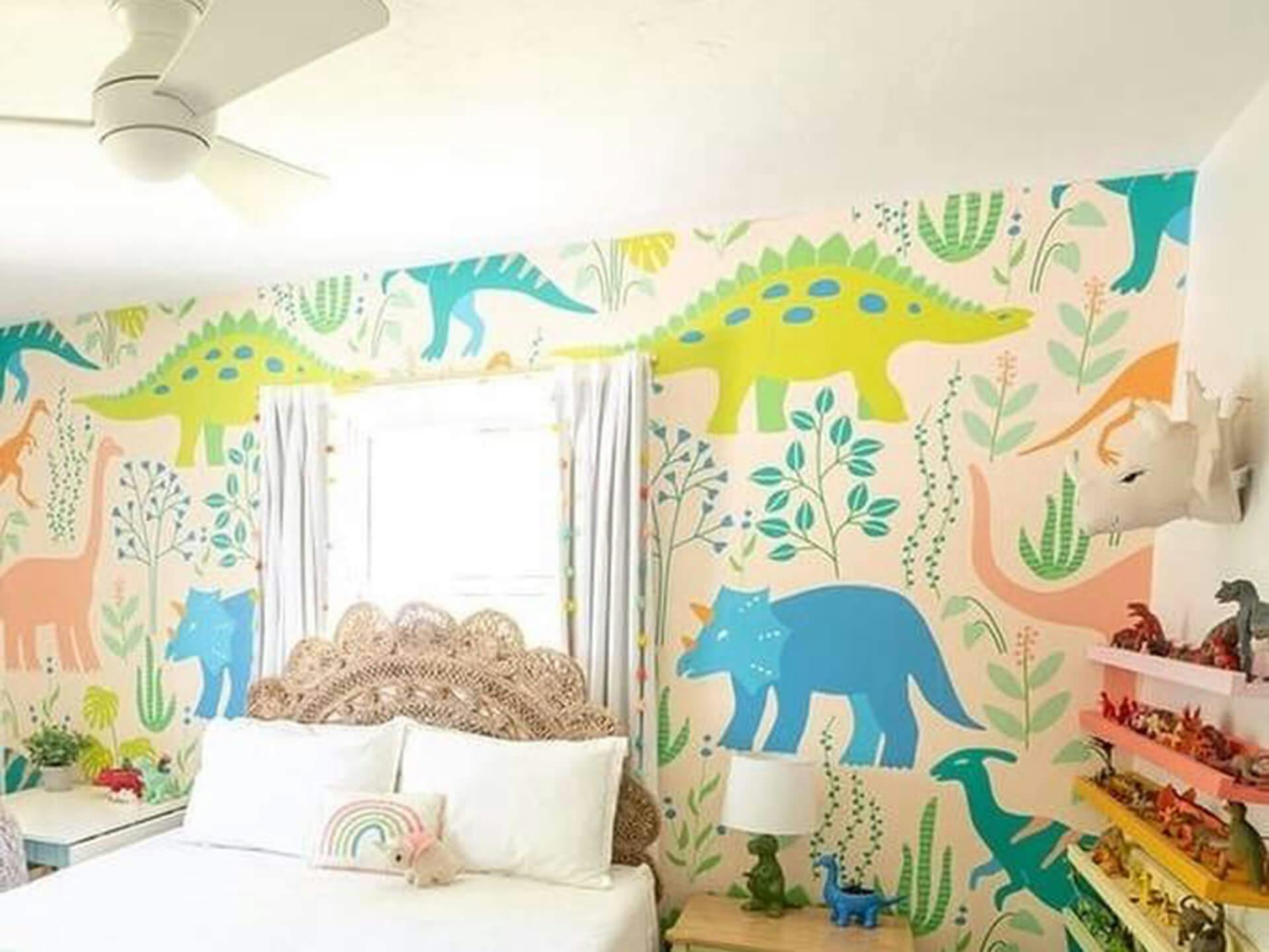 Daylit children's bedroom with cartoon dinosaurs on the wall