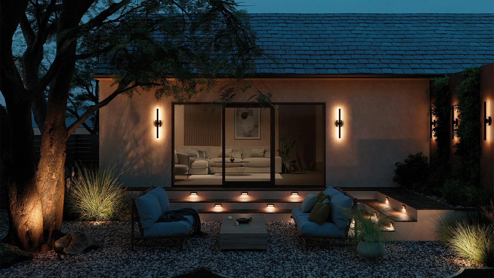 Nightime shot of exterior patio with nocar wall lights at night