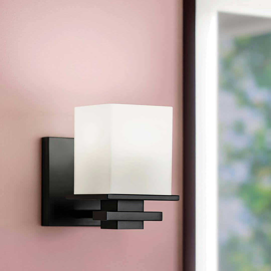 Bathroom in day light with the Tully 6.5" 1-Light Wall Sconce in Black