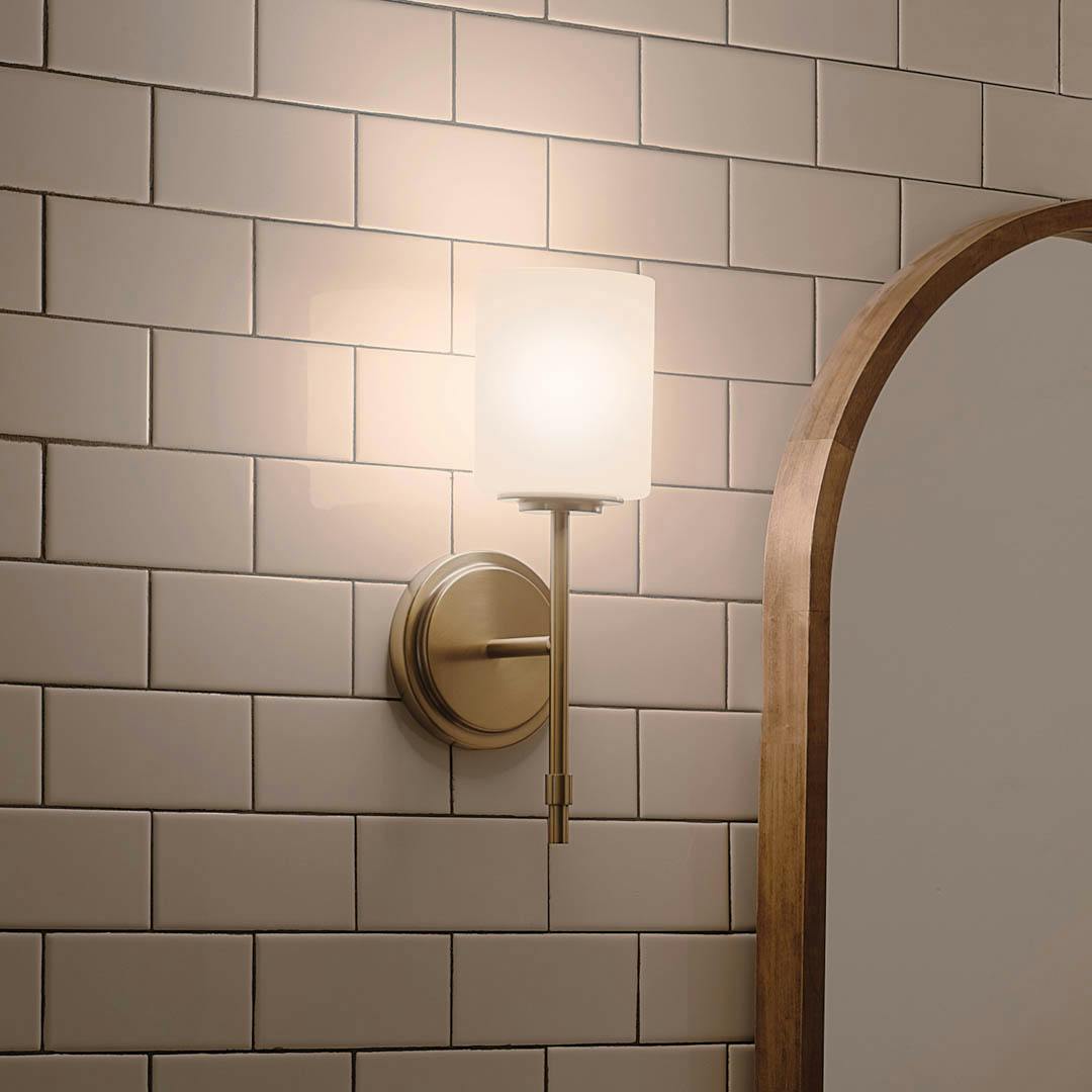 Night time bathroom with Ali 14.5" 1 Light Vanity Brushed Natural Brass