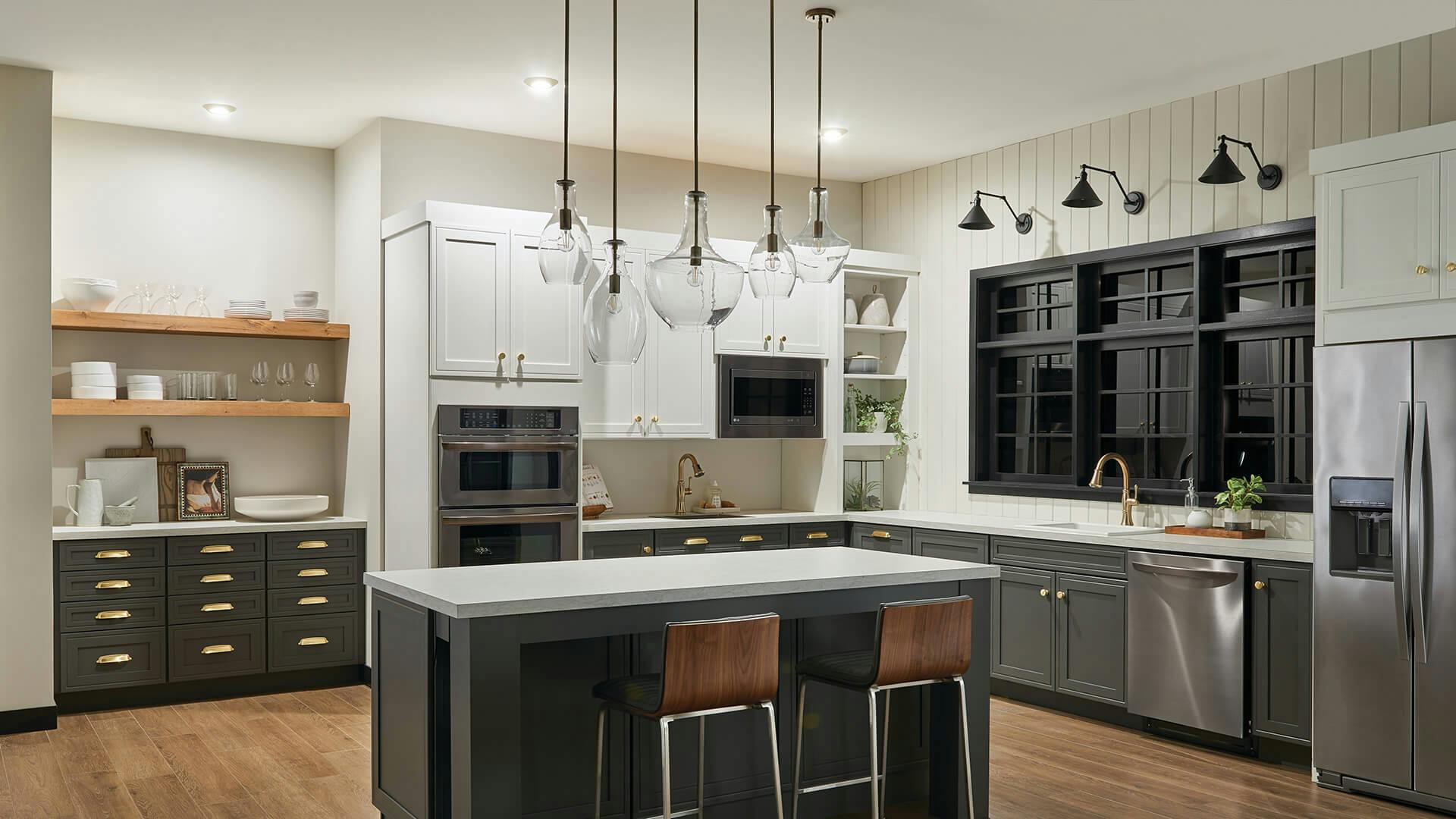 A kitchen with ceiling lights turned on at night while the featured Everly and Ellerbeck lights are off
