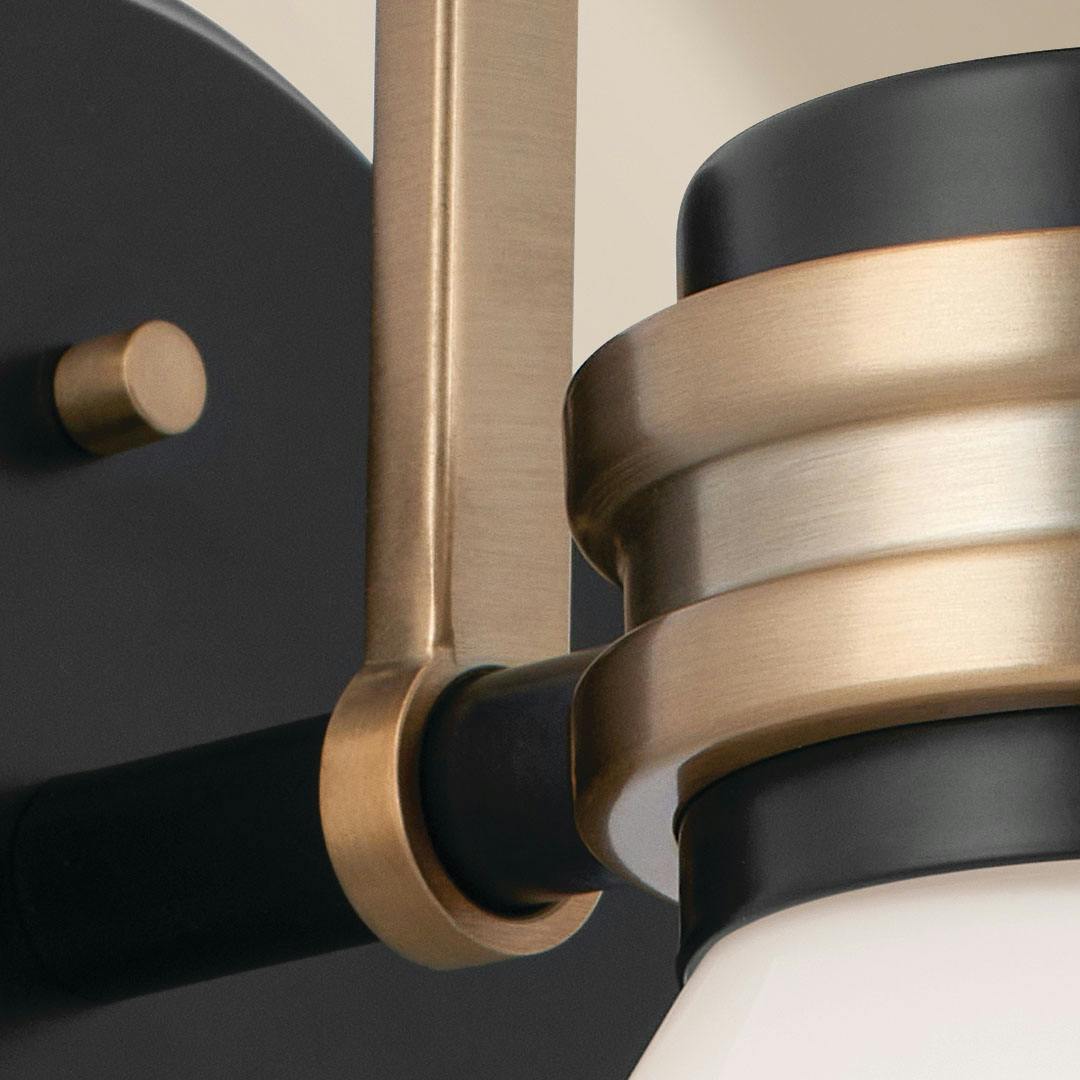 Close up of the Farum 9.5 Inch 1 Light Wall Sconce with Opal Glass in Black with Champagne Bronze