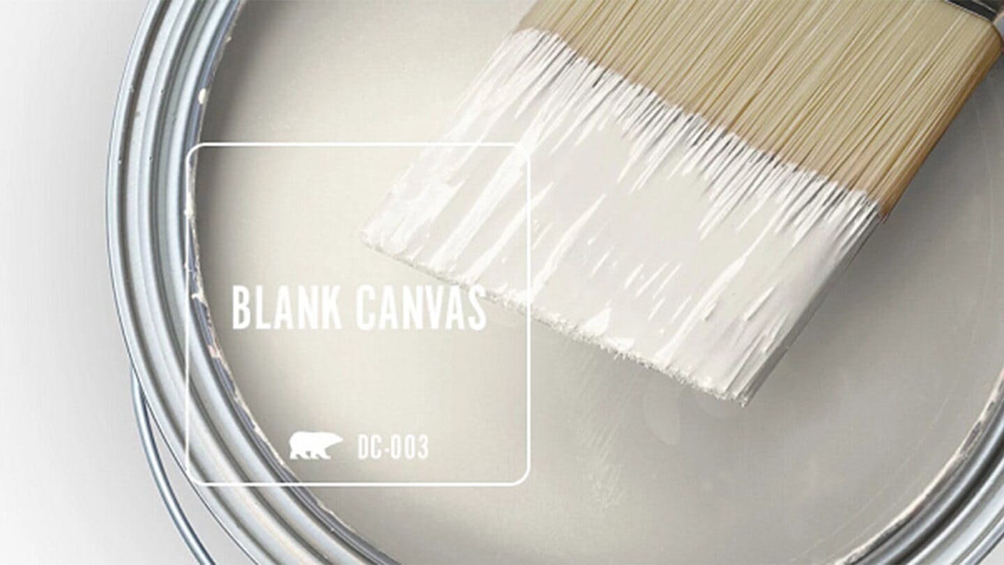 Blank Canvas paint can and brush.