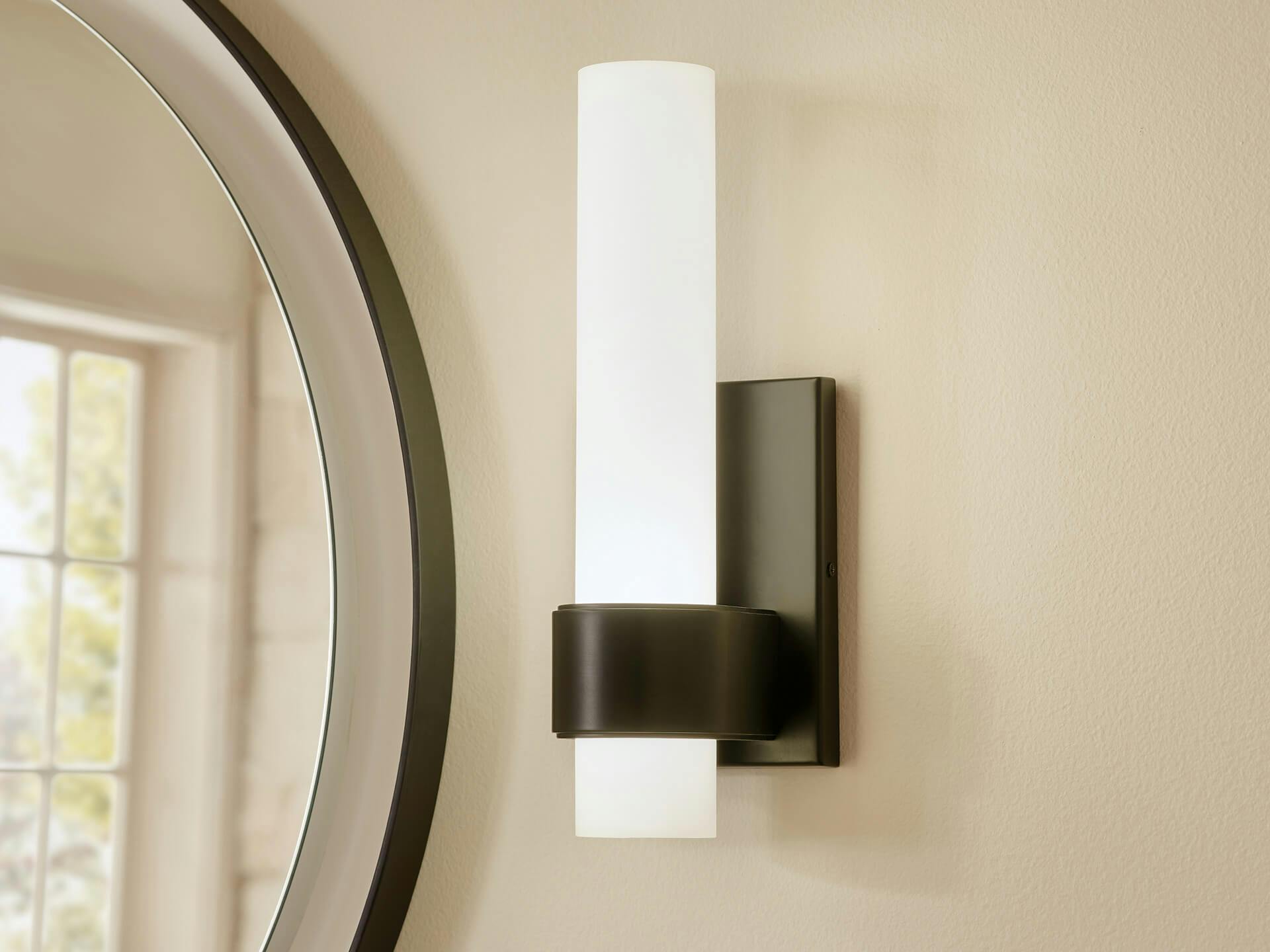 Close up of an izza wall sconce in black finish