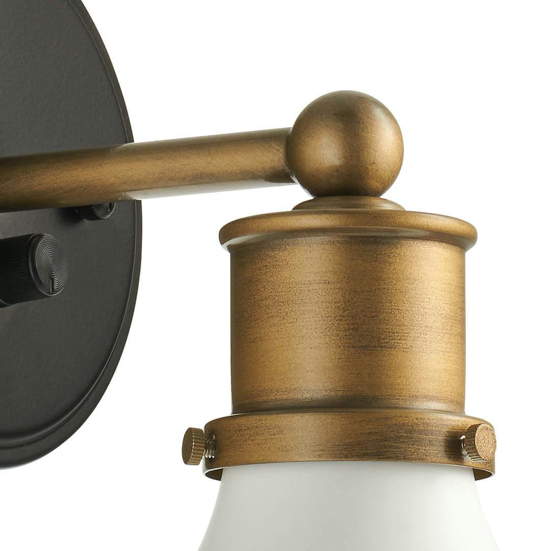 Close up of the Ernest 11 Inch 1 Light Plug-In Wall Sconce in Natural Brass and Matte Blackon a white background
