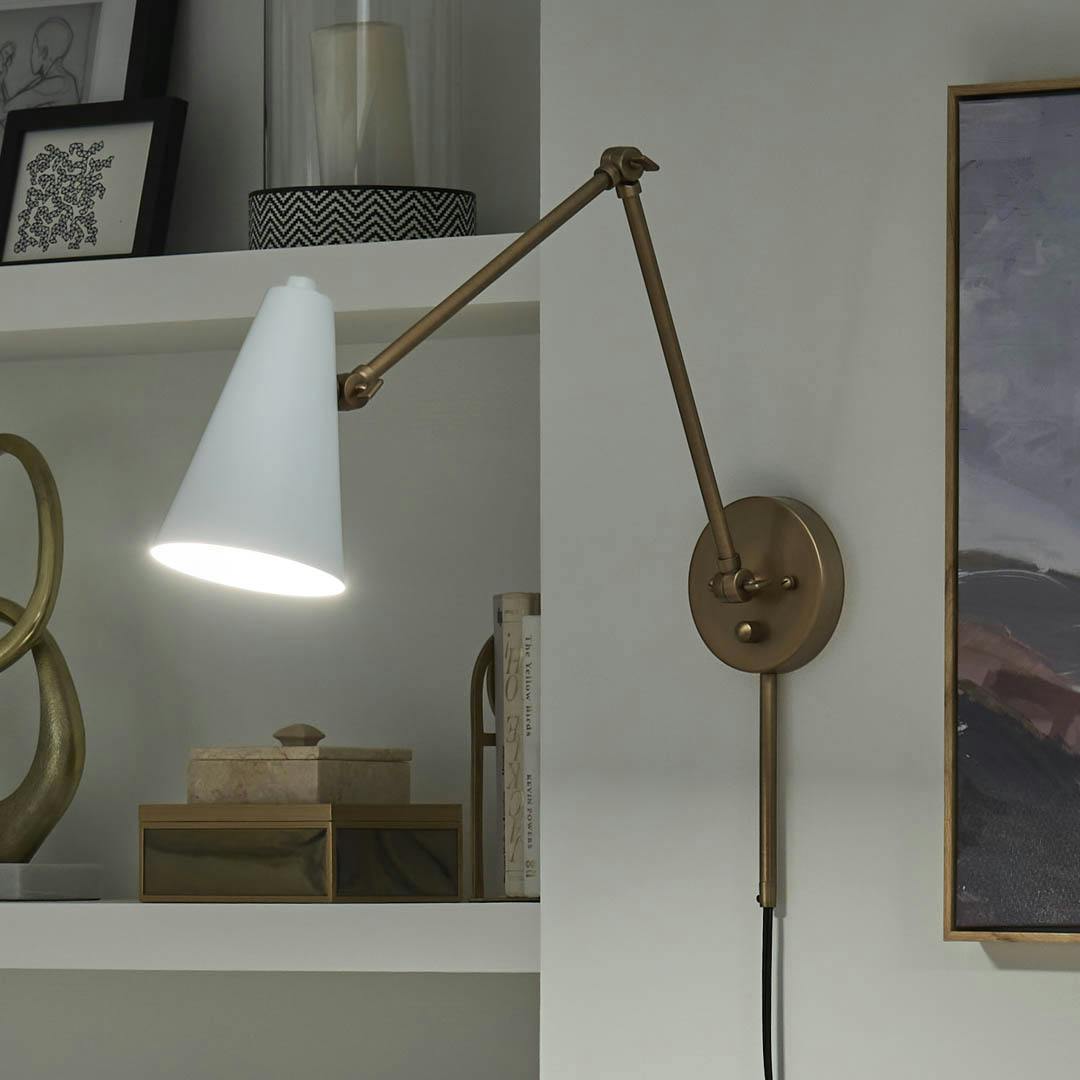 Night time office with Sylvia 1 Light Wall Sconce Natural Brass