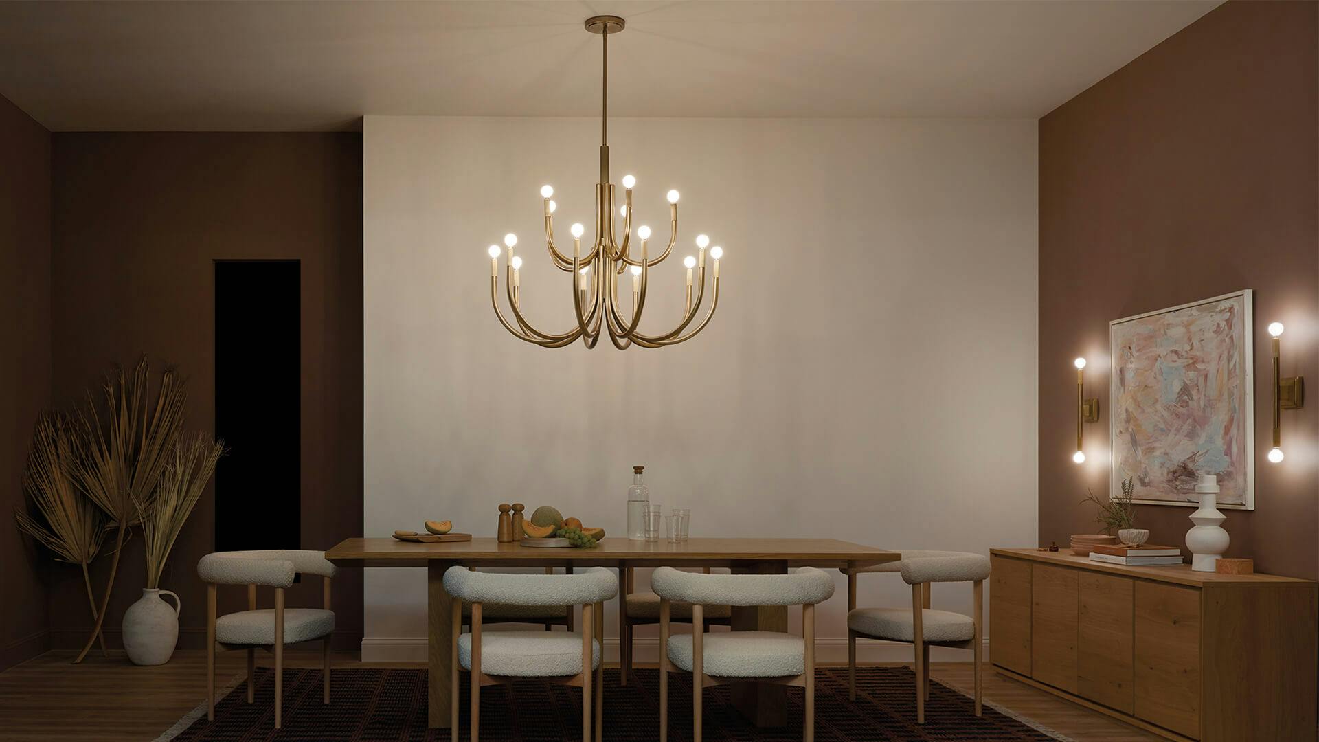 Dining room with modern furnishings and Odensa 15-light chandelier in champagne bronze