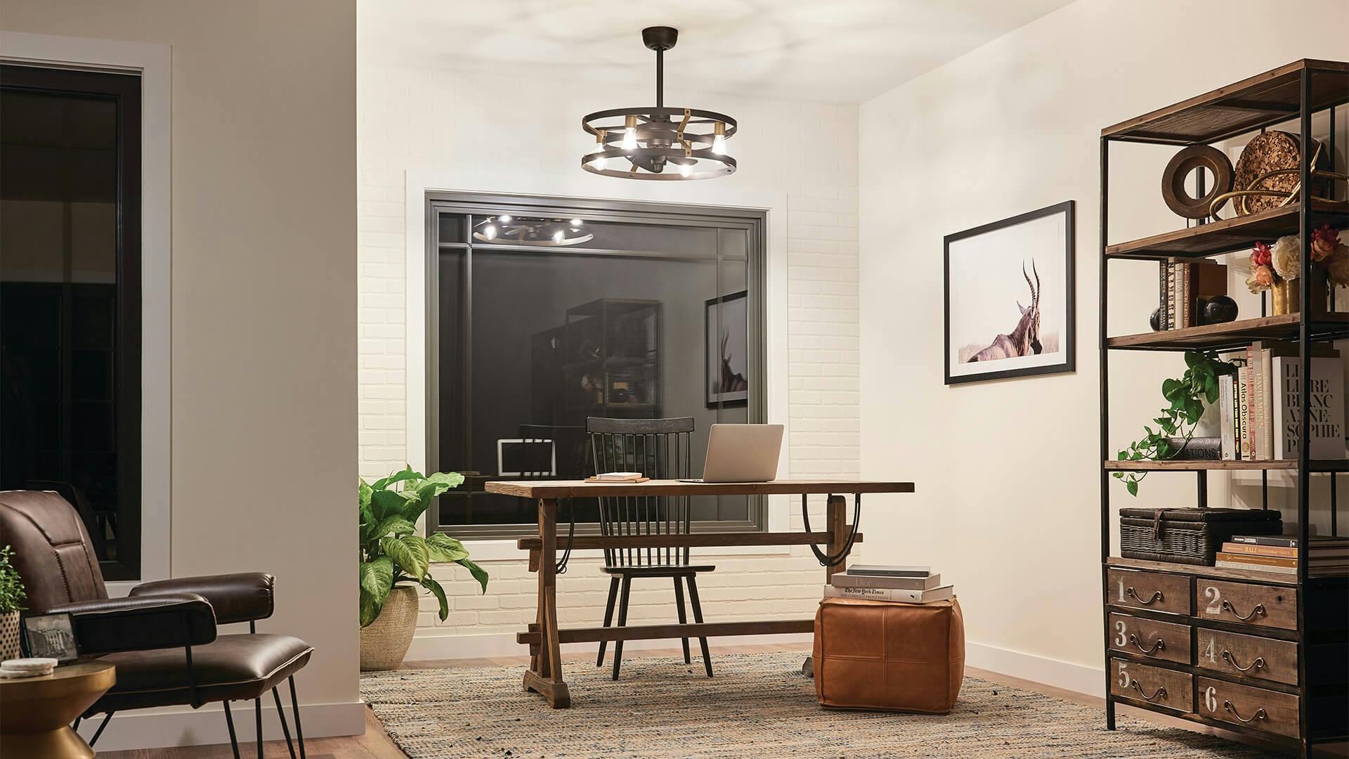 Mid-century modern office at night with Cavelli chandelier