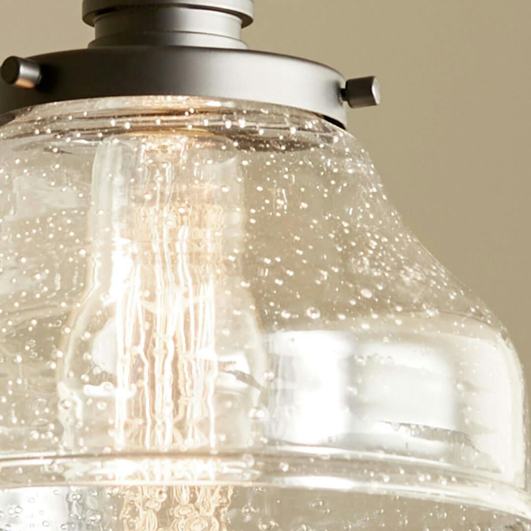 Close up of the Avery 8.5 Inch 1 Light Bell Mini Pendant with Clear Seeded Glass in Black