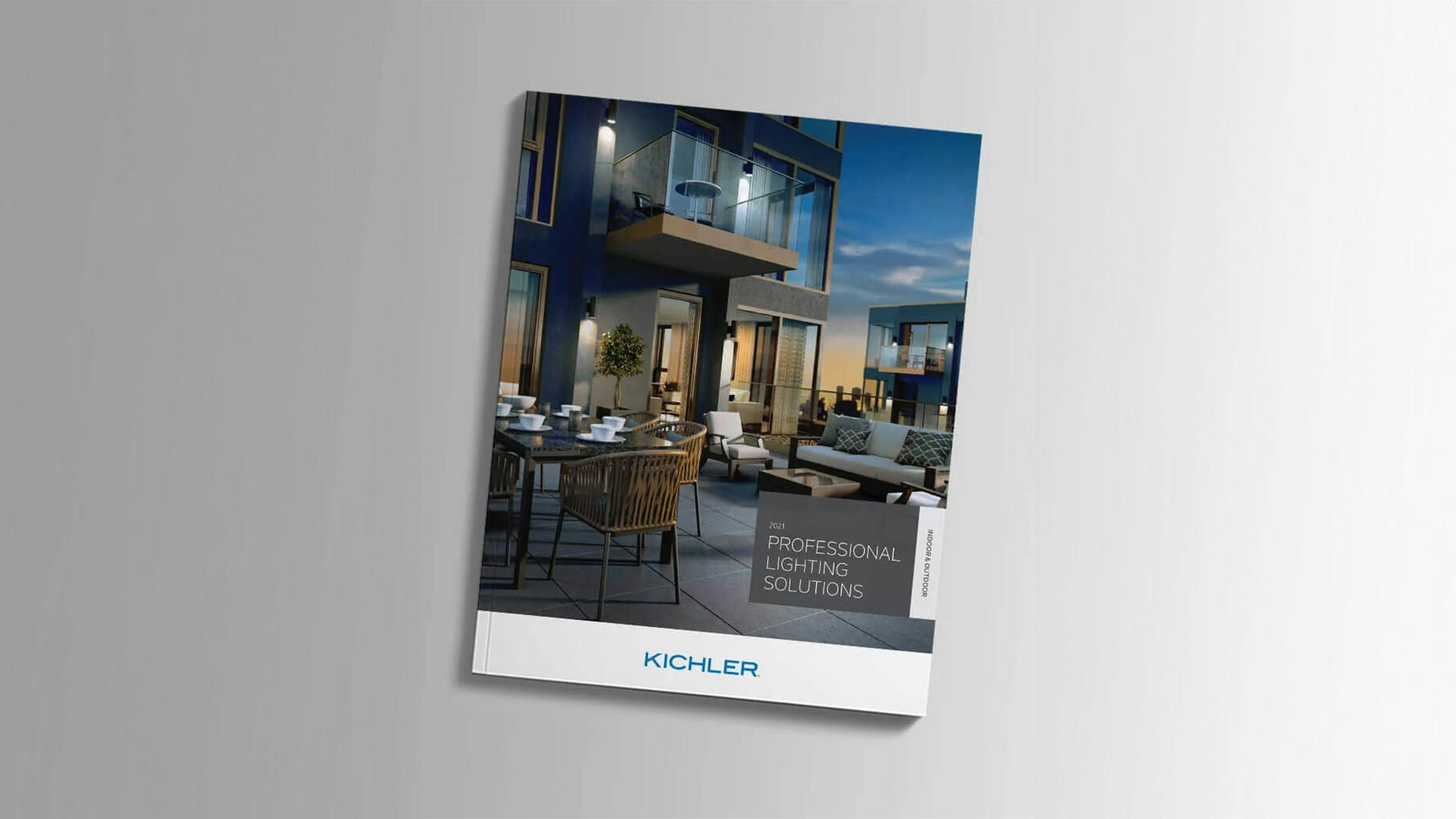 Catalog cover featuring a roof top patio with variety of tables and chairs in the evening and titled professional lighting solutions