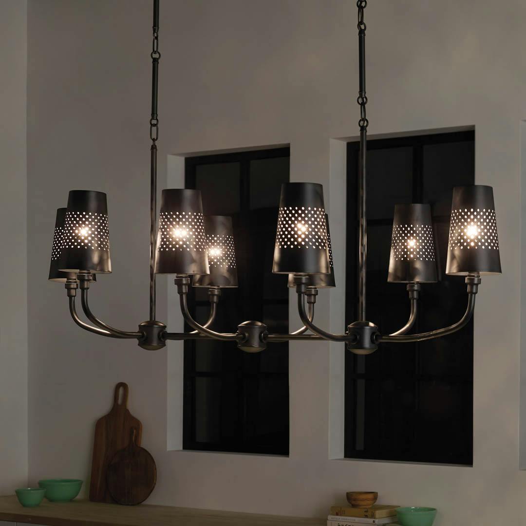 Night time kitchen with Adeena 47.25" 8 Light Linear Chandelier Black