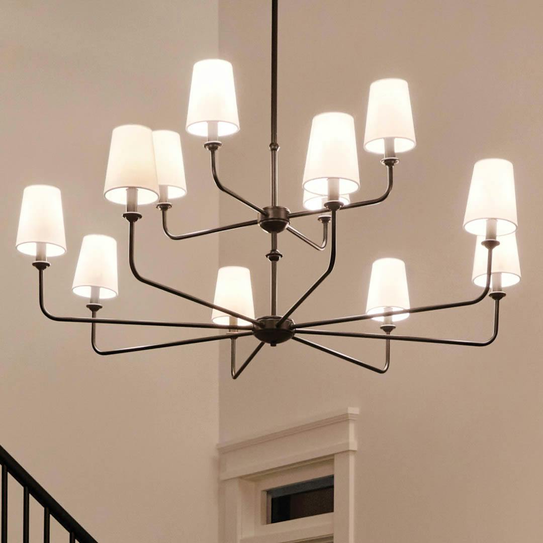 Night time foyer with Pallas 42.75" 12 Light Chandelier Black
