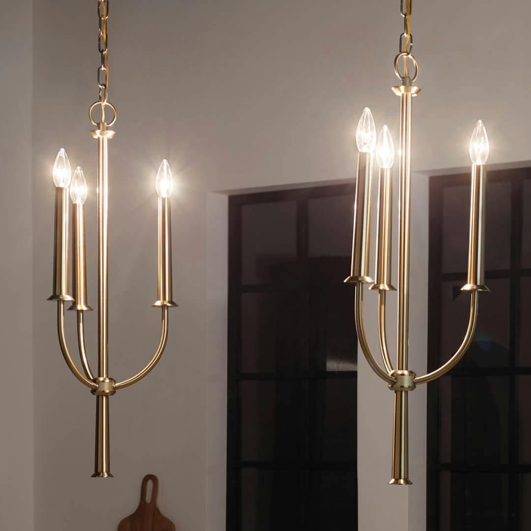 Night time kitchen with Florence 28.5" 3 Light Pendant Brushed Natural Brass