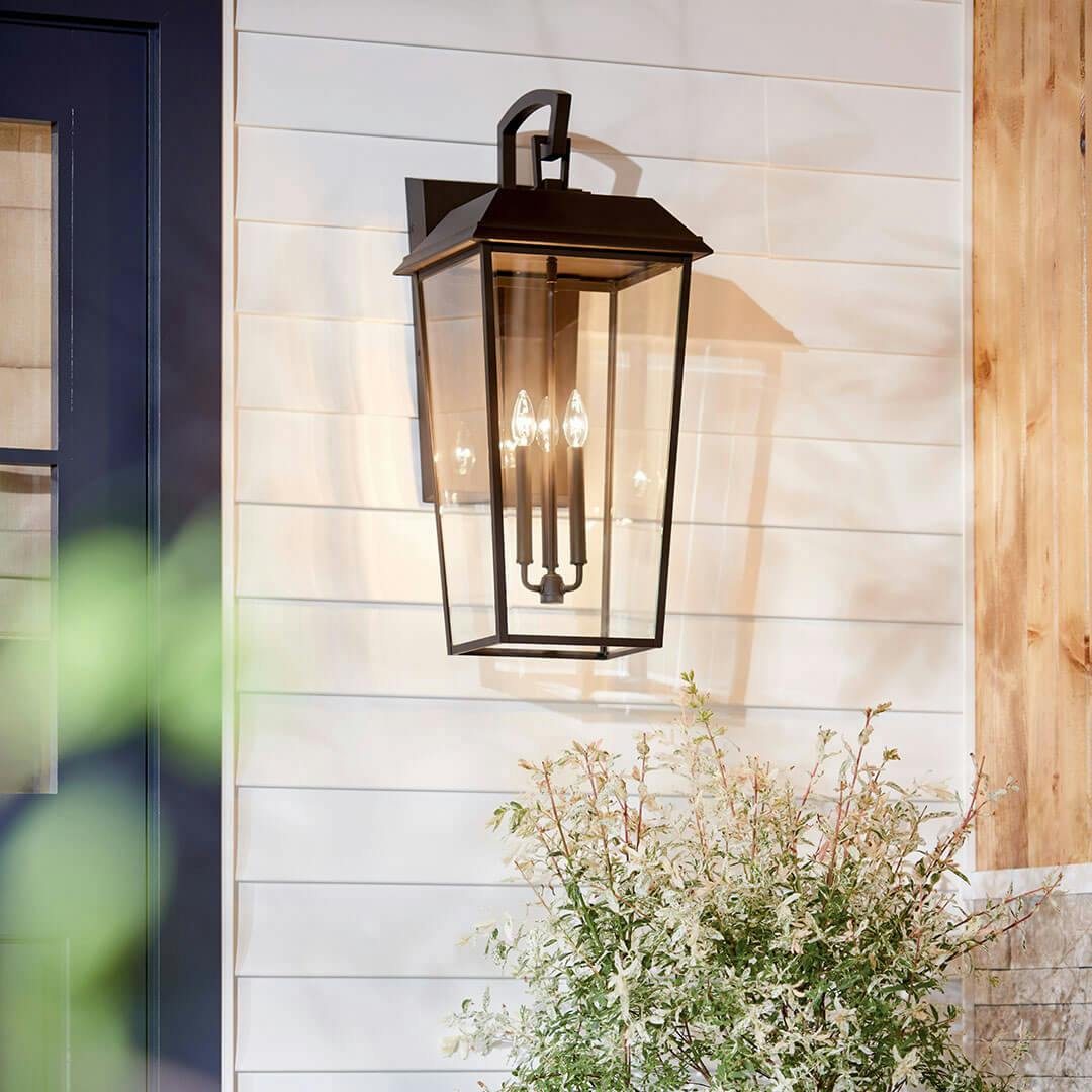 Porch featuring the Mathus 30.25" 3 Light Outdoor Wall Light with Clear Glass in Olde Bronze