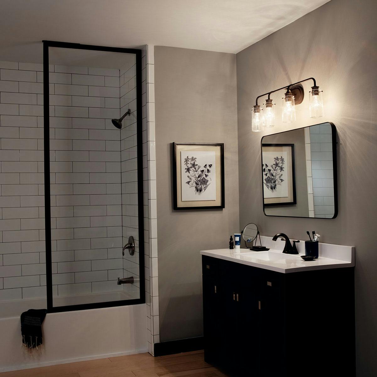 Night time Bathroom featuring Braelyn vanity light 45460OZ