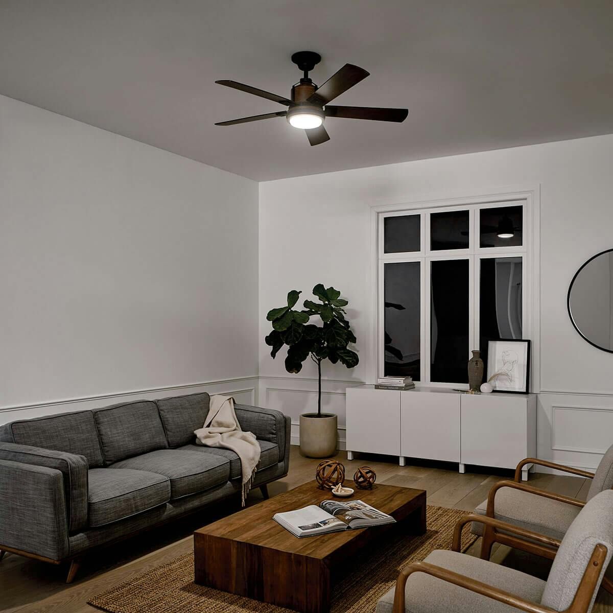 Night time living room image featuring Colerne ceiling fan 300052DBK