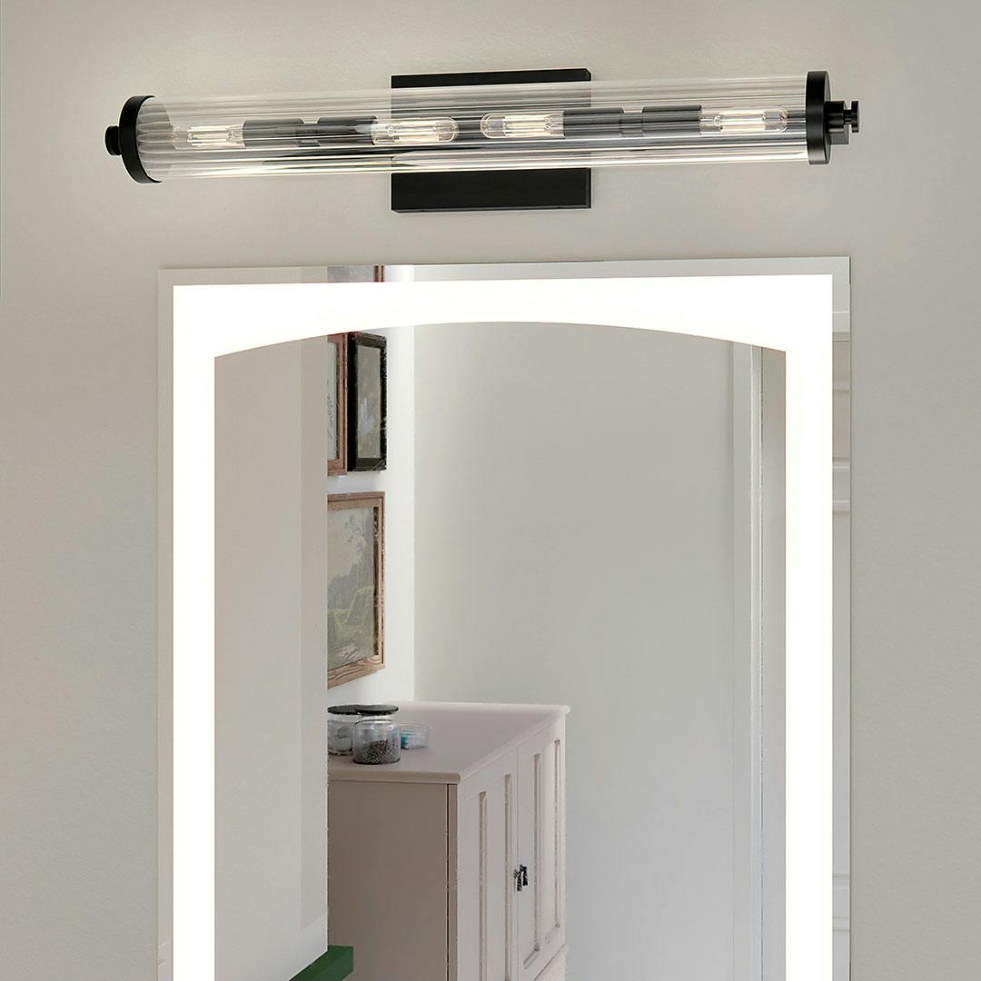 Bathroom in day light with the Azores 25" 4-Light Linear Vanity Light in Black