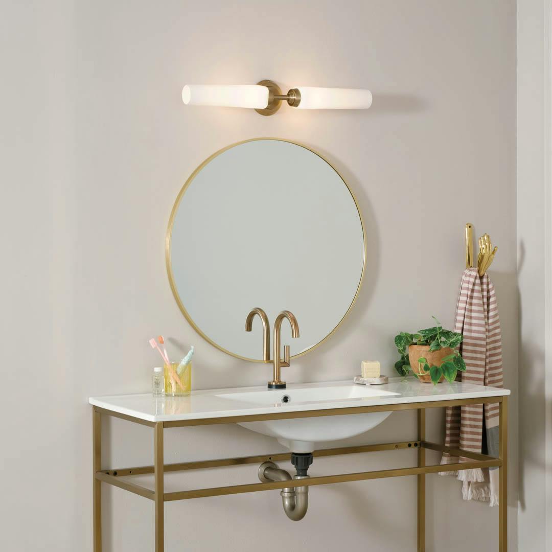 Day time bathroom with Truby 24.75 Inch 2 Light Vanity Light with Satin Etched Cased Opal Glass in Champagne Bronze