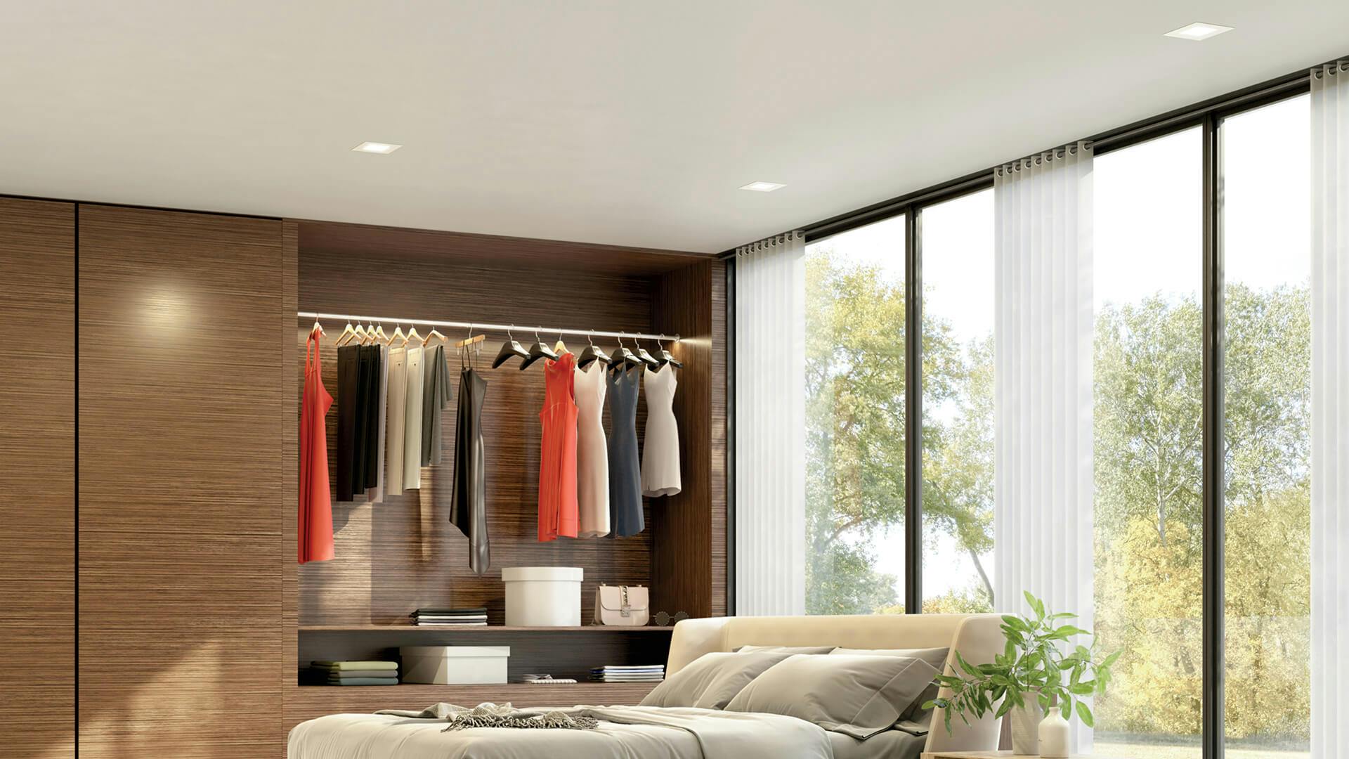 Lifestyle image of a bedroom with DTC flush ceiling lights 