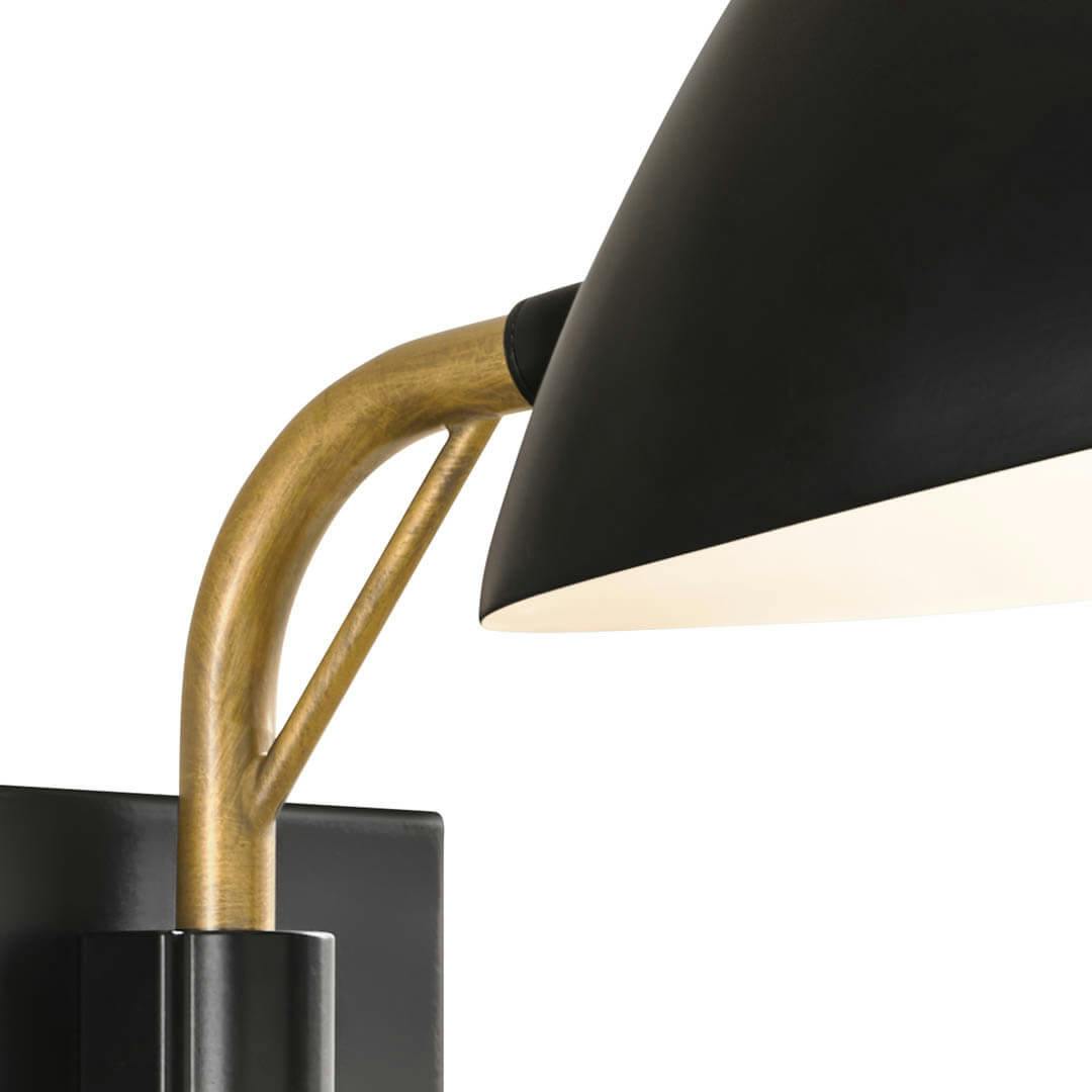 Close up of the Rico 11.5 Inch 1 Light Plug-In Wall Sconce in Matte Black and Natural Brasson a white background
