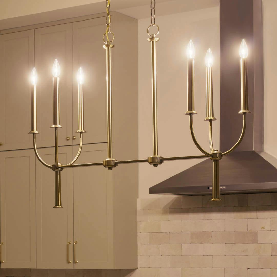 Night time kitchen with Florence 40" 6 Light Linear Chandelier Brushed Natural Brass