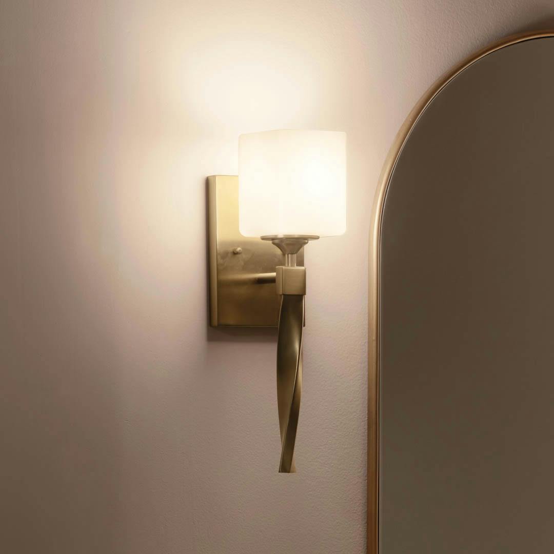 Night time bathroom with Marette 5 inch 1 Light Sconce  with Satin Etched Cased Opal Glass in Champagne Bronze