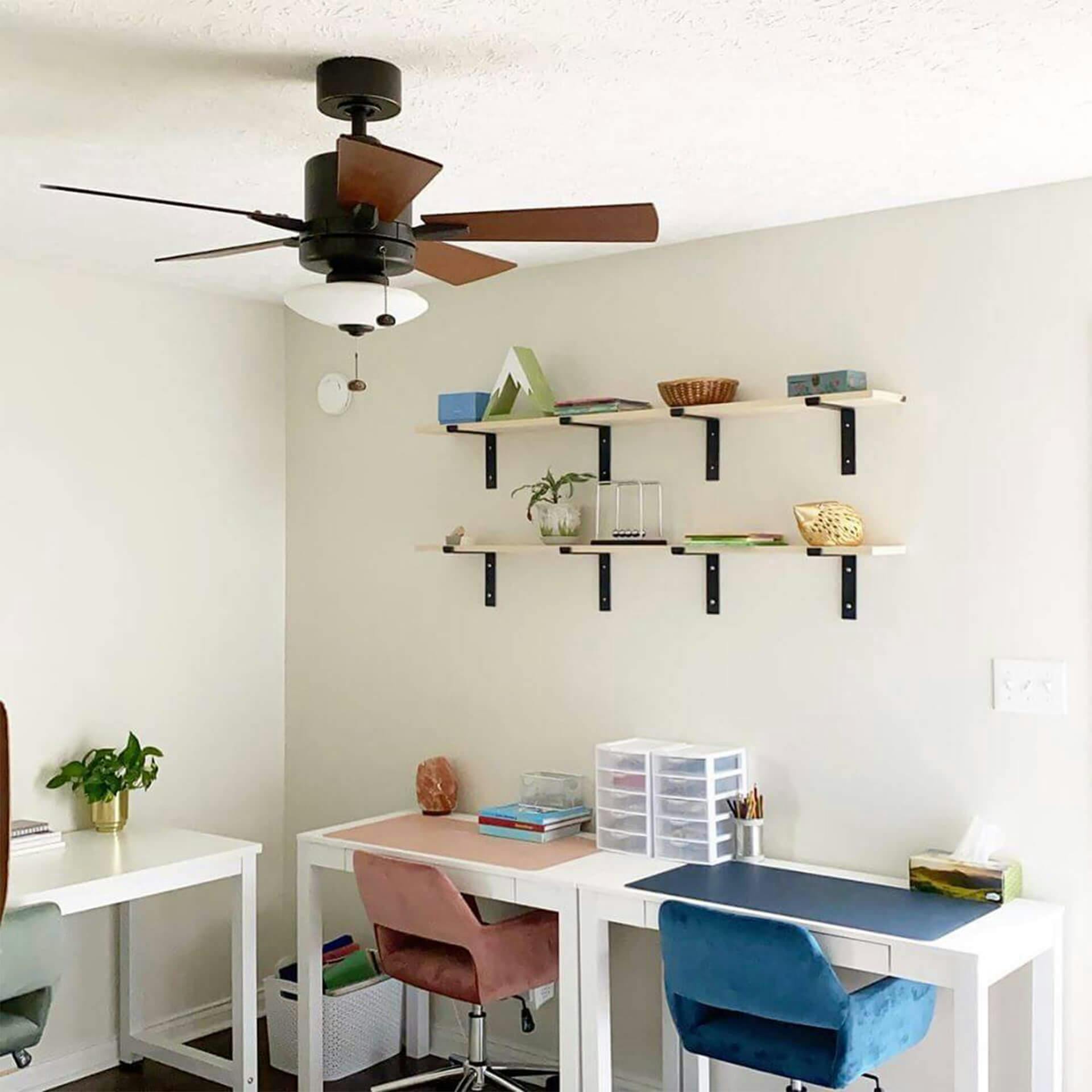 Home office featuring ceiling fan and 3 desks for kids
