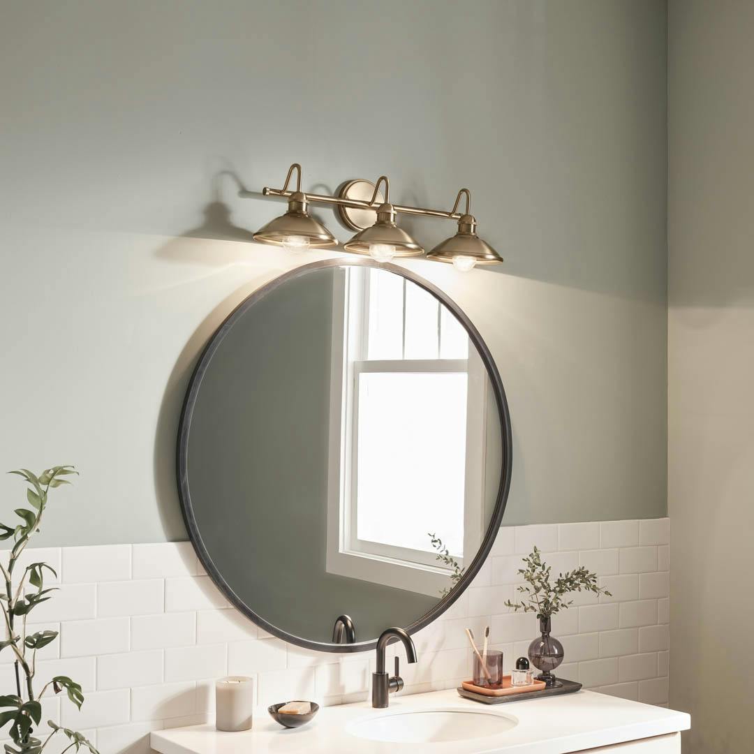 Day time bathroom with Clyde 3 Light Vanity Light Champagne Bronze