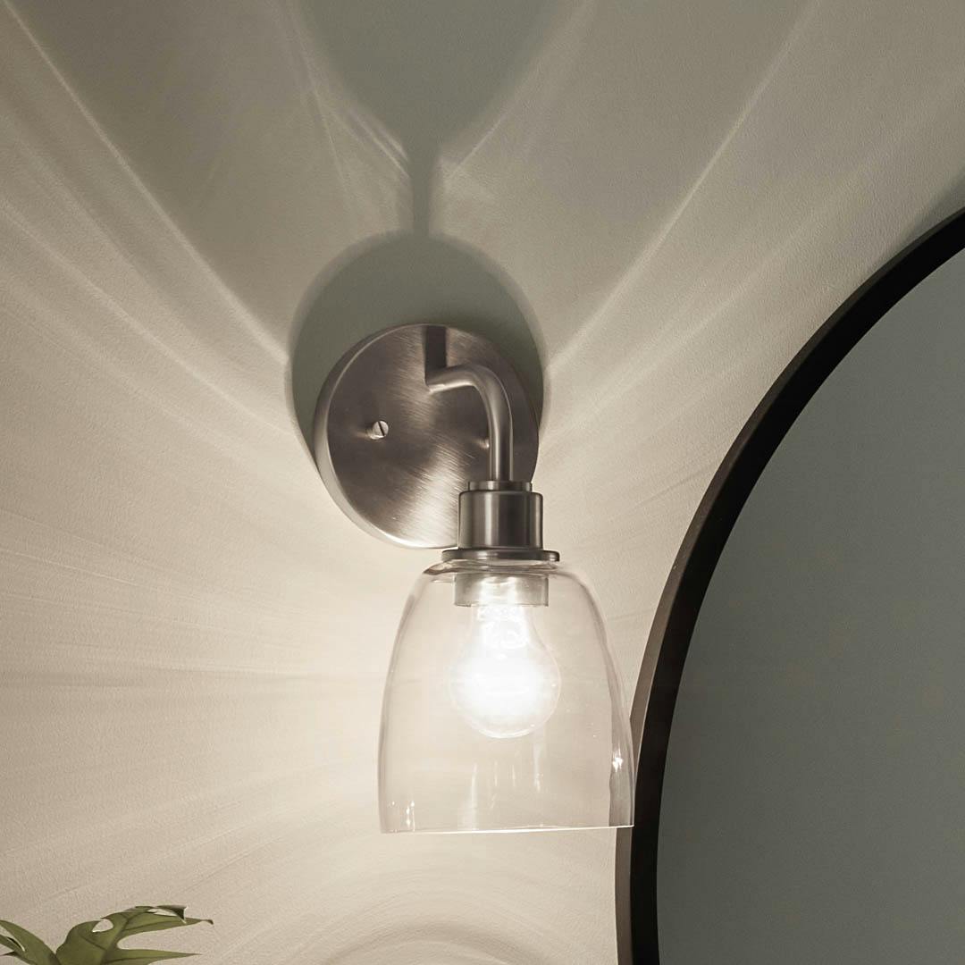 Night time bathroom with Meller 11.25 Inch 1 Light Wall Sconce with Clear Glass in  Brushed Nickel