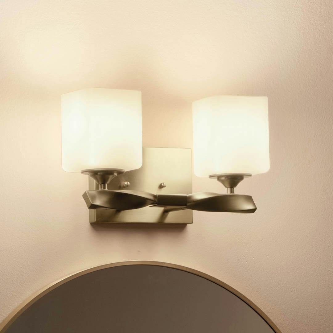 Night time bathroom with Marette 13.5 inch 2 Light Vanity Light with Satin Etched Cased Opal Glass in Champagne Bronze