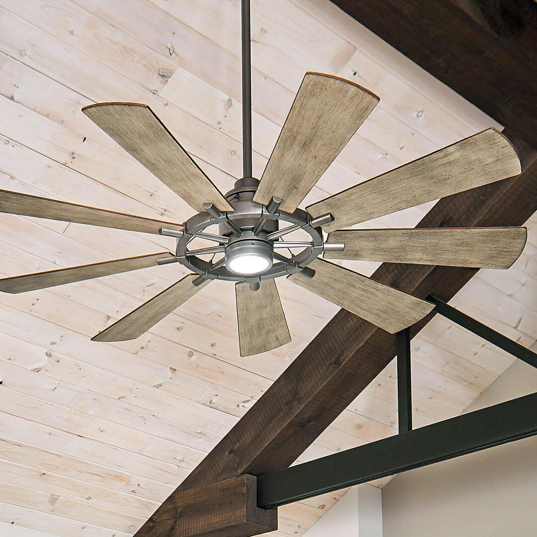Living room with Gentry LED 65" 9 Blade Fan in Anvil Iron