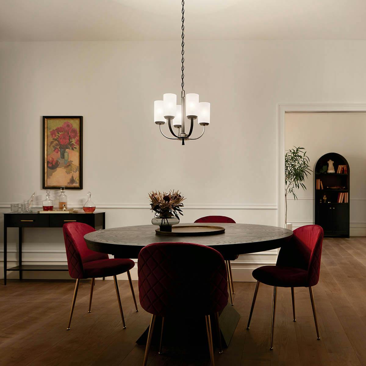 night time dining room with Kennewick 5 Light Chandelier Black
