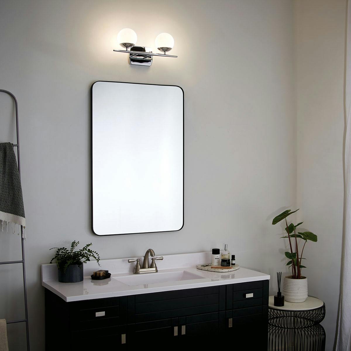 Night time Bathroom featuring Jasper vanity light 45581CH