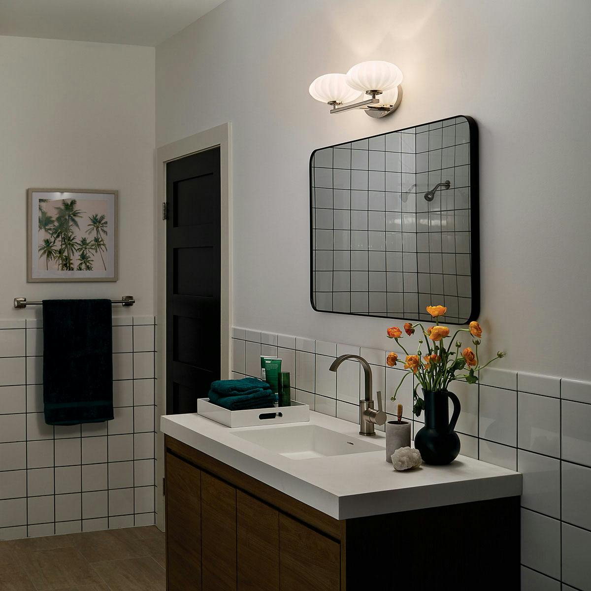 Night time Bathroom featuring Pim vanity light 55024PN