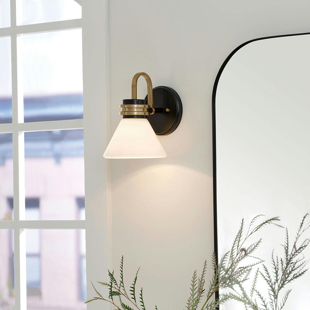 Day time bathroom with the Farum 9.5 Inch 1 Light Wall Sconce with Opal Glass in Black with Champagne Bronze