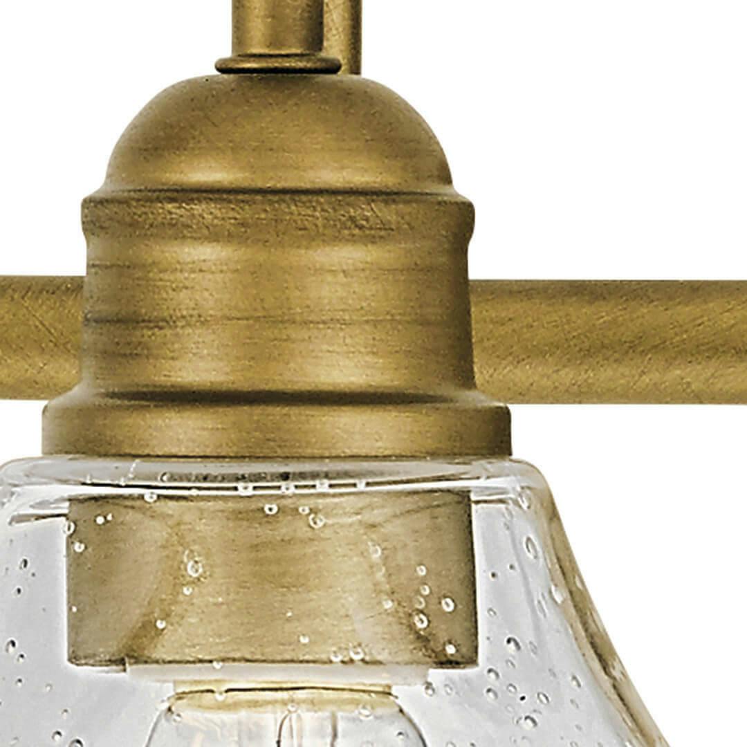 Close up view of the Avery 2 Light Vanity Light Natural Brass on a white background